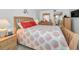 Bedroom featuring queen-sized bed and ensuite bathroom for convenient access at 19925 Gulf Blvd # 503, Indian Shores, FL 33785