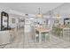 Bright dining area features tile flooring and a decorative chandelier at 19925 Gulf Blvd # 503, Indian Shores, FL 33785