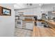 Bright kitchen with stainless steel sink and white appliances at 19925 Gulf Blvd # 503, Indian Shores, FL 33785