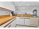 Bright kitchen boasts white appliances and wood countertops at 19925 Gulf Blvd # 503, Indian Shores, FL 33785