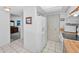 Bright kitchen features pantry, tile floors and white appliances at 19925 Gulf Blvd # 503, Indian Shores, FL 33785