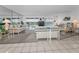 Bright living room with sliding glass doors leading to a balcony and providing gorgeous water views at 19925 Gulf Blvd # 503, Indian Shores, FL 33785