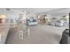 Open living area features a neutral color palette with access to dining area; great layout for entertaining at 19925 Gulf Blvd # 503, Indian Shores, FL 33785