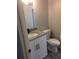 Updated bathroom with granite countertop, modern sink, toilet, and neutral color scheme at 211 Harmony Ln, Brandon, FL 33511