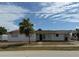 Front exterior view featuring the lawn, carport, driveway, and front entrance at 21811 Edgewater Dr, Port Charlotte, FL 33952