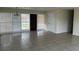 Spacious living room with tiled floors, bright windows and view of front yard at 21811 Edgewater Dr, Port Charlotte, FL 33952