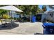 Backyard patio with outdoor seating, lush greenery, and storage shed offering ample space at 2505 Minnehaha, Tampa, FL 33614