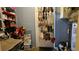 Basement storage area with shelving, storage, and an organized shoe rack on the back of the door at 2505 Minnehaha, Tampa, FL 33614