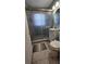Bathroom featuring a glass-door shower, tiled floors, vanity, toilet, and minimalist design at 2505 Minnehaha, Tampa, FL 33614