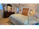 Bright bedroom with a large bed, wood-look floors, closet, and natural light at 2505 Minnehaha, Tampa, FL 33614