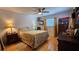 Cozy bedroom featuring a ceiling fan, hardwood floors, and ample natural light from a window at 2505 Minnehaha, Tampa, FL 33614