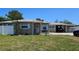 Charming single-story brick home featuring a well-maintained lawn and an attached carport at 2505 Minnehaha, Tampa, FL 33614