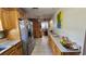 Spacious kitchen with lots of counter space, stainless steel refrigerator, and tile flooring at 2505 Minnehaha, Tampa, FL 33614