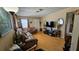 Cozy living room featuring hardwood floors, comfortable seating, and ample natural light at 2505 Minnehaha, Tampa, FL 33614