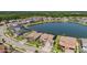 Aerial view of home with lake in backyard in a lovely residential neighborhood at 28857 Picana Ln, Wesley Chapel, FL 33543