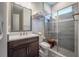 Modern bathroom with a glass-enclosed shower and elegant vanity at 28857 Picana Ln, Wesley Chapel, FL 33543