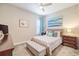 Cozy bedroom with a patterned bedspread and coordinated furnishings at 28857 Picana Ln, Wesley Chapel, FL 33543