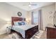 Cozy bedroom featuring stylish decor, a comfortable bed, and ample natural light for a restful retreat at 28857 Picana Ln, Wesley Chapel, FL 33543