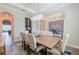 Elegant dining room featuring a modern chandelier, wine storage, and stylish decor at 28857 Picana Ln, Wesley Chapel, FL 33543