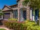 Lovely front exterior with a beautiful stone facade and manicured landscaping at 28857 Picana Ln, Wesley Chapel, FL 33543