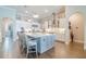 Spacious kitchen with a large central island with barstool seating and plenty of countertop space at 28857 Picana Ln, Wesley Chapel, FL 33543