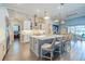 Spacious kitchen island, stainless steel appliances, and open-concept design to dining area at 28857 Picana Ln, Wesley Chapel, FL 33543
