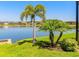 Great lake views from this lush green lawn, providing a peaceful oasis at 28857 Picana Ln, Wesley Chapel, FL 33543