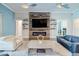 Spacious living room with fireplace, a decorative wall, and ample seating at 28857 Picana Ln, Wesley Chapel, FL 33543