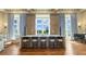 A stylish community lounge with ample windows, natural light, and a high-top counter with stools for casual seating at 28857 Picana Ln, Wesley Chapel, FL 33543