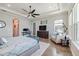 Spacious main bedroom featuring hardwood floors, sitting area, and ample natural light at 28857 Picana Ln, Wesley Chapel, FL 33543