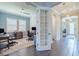Home office with wood floors, built-ins, and a large window providing natural light, creating an ideal workspace at 28857 Picana Ln, Wesley Chapel, FL 33543