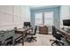 Spacious home office with custom paneling, natural light and ample room for dual workspaces at 28857 Picana Ln, Wesley Chapel, FL 33543