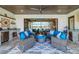 Inviting outdoor patio with full kitchen and scenic lake views at 28857 Picana Ln, Wesley Chapel, FL 33543