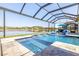 Beautiful screened pool with spa and lake view in this luxurious home at 28857 Picana Ln, Wesley Chapel, FL 33543