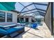 Spacious outdoor area with a pool, seating, and a beautiful view at 28857 Picana Ln, Wesley Chapel, FL 33543