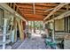 Barn interior with natural wood beams, ladder, and wheelbarrow at 2947 Cedar Trce, Tarpon Springs, FL 34688