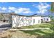 This modern home has clean lines, an attached carport, and a well manicured lawn at 2947 Cedar Trce, Tarpon Springs, FL 34688
