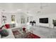 Spacious living room with white marble floors, modern furniture, and large windows at 2947 Cedar Trce, Tarpon Springs, FL 34688