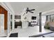 Indoor outdoor living space with ceiling fan, TV and access to the pool at 2947 Cedar Trce, Tarpon Springs, FL 34688