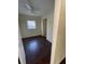 Cozy bedroom featuring laminate wood flooring, a window, and a ceiling fan at 321 David Ave, Clearwater, FL 33759