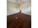 Bright bedroom with hardwood floors and a ceiling fan with easy access to a private bathroom at 321 David Ave, Clearwater, FL 33759