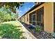The backyard features an enclosed patio and landscaped area with lush green grass at 329 Seneca Falls Dr, Apollo Beach, FL 33572