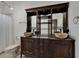 Bathroom with an antique vanity, dual vessel sinks, and decorative mirror at 329 Seneca Falls Dr, Apollo Beach, FL 33572
