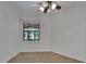 An empty bedroom features neutral carpet, white walls and a ceiling fan at 329 Seneca Falls Dr, Apollo Beach, FL 33572