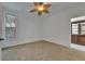 Comfortable bedroom with natural light from windows and a ceiling fan at 329 Seneca Falls Dr, Apollo Beach, FL 33572