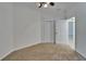 Bedroom with ceiling fan, closet doors and view to another room at 329 Seneca Falls Dr, Apollo Beach, FL 33572