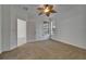 Bedroom with large windows and a ceiling fan with a palm-leaf design at 329 Seneca Falls Dr, Apollo Beach, FL 33572