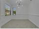 Dining room with natural light from the windows and a view to the backyard at 329 Seneca Falls Dr, Apollo Beach, FL 33572