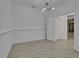 Spacious dining room featuring decorative wainscoting, modern lighting, and tiled floors at 329 Seneca Falls Dr, Apollo Beach, FL 33572