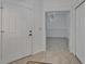 Bright entryway with tile flooring and a view into a dining room with white walls at 329 Seneca Falls Dr, Apollo Beach, FL 33572